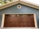 Attractive brown garage door adding warmth to the home's exterior at 526 Emerson Rd, Carmel, IN 46032