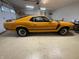 Well-maintained garage with a classic car and epoxy flooring, providing secure parking and storage at 526 Emerson Rd, Carmel, IN 46032