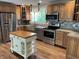 Charming kitchen with wood cabinets, granite countertops, stainless appliances, and center island at 526 Emerson Rd, Carmel, IN 46032