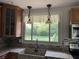 Kitchen featuring a sink with a window overlooking the backyard at 526 Emerson Rd, Carmel, IN 46032
