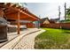 Beautiful backyard patio features a pergola, comfortable seating, and well-maintained landscaping at 608 E 9Th St, Indianapolis, IN 46202