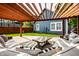 Inviting backyard patio with a modern pergola, stylish seating, and a lush green lawn at 608 E 9Th St, Indianapolis, IN 46202