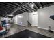 Finished basement with exposed ceiling, workout area, play area, and durable flooring at 608 E 9Th St, Indianapolis, IN 46202