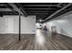 Large basement area, open ceiling, and ample space for recreational activities at 608 E 9Th St, Indianapolis, IN 46202