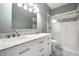 Bathroom features double vanity, marble countertops, a glass shower and a modern design at 608 E 9Th St, Indianapolis, IN 46202
