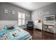 Cozy bedroom features natural light, colorful bedding and plenty of storage at 608 E 9Th St, Indianapolis, IN 46202