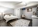 Cozy bedroom with a comfortable bed, accent rug, and ample natural light at 608 E 9Th St, Indianapolis, IN 46202