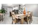 Elegant dining room adjacent to a kitchen featuring hardwood table and bright decor at 608 E 9Th St, Indianapolis, IN 46202