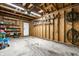 Well-lit garage featuring exposed beams and ample space for storage and organization at 608 E 9Th St, Indianapolis, IN 46202