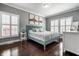 Spacious main bedroom with a modern color scheme, hardwood floors and lots of natural light at 608 E 9Th St, Indianapolis, IN 46202