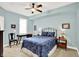 Bedroom with ceiling fan, a writing desk, and a serene atmosphere at 622 E 10Th St # 310, Indianapolis, IN 46202