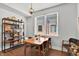 Bright dining area with a wooden table, modern chairs, and stylish decorative shelving at 622 E 10Th St # 310, Indianapolis, IN 46202