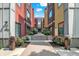Inviting pathway leading to the building entrance, surrounded by colorful architecture and beautiful landscaping at 622 E 10Th St # 310, Indianapolis, IN 46202