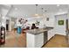 Open kitchen with stainless steel appliances, a large island and views of the living area at 622 E 10Th St # 310, Indianapolis, IN 46202