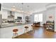 Modern kitchen with stainless steel appliances, a spacious island, and stylish barstool seating at 622 E 10Th St # 310, Indianapolis, IN 46202