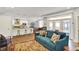 Open-concept living room with stylish furnishings seamlessly integrates with modern kitchen and dining area at 622 E 10Th St # 310, Indianapolis, IN 46202