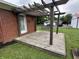 Inviting back patio featuring a wooden deck with a pergola, perfect for entertaining at 6237 E Lynn Dr, Mooresville, IN 46158