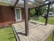 Back patio featuring a wooden pergola, a porch swing, and a view of the backyard at 6237 E Lynn Dr, Mooresville, IN 46158