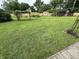 Large backyard with newly installed wooden fence, a shed, and a trellis, creating a serene outdoor space at 6237 E Lynn Dr, Mooresville, IN 46158