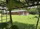 View of home in backyard through grape vines at 6237 E Lynn Dr, Mooresville, IN 46158