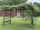 Picturesque backyard featuring a covered trellis, offering shade and curb appeal at 6237 E Lynn Dr, Mooresville, IN 46158