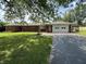Charming brick ranch-style home with well-manicured lawn and attached garage at 6237 E Lynn Dr, Mooresville, IN 46158