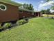 Attractive front yard featuring fresh mulch, flower beds, and lush green grass at 6237 E Lynn Dr, Mooresville, IN 46158