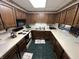 Kitchen features tile floors, a white countertop, wooden cabinets and modern appliances at 6237 E Lynn Dr, Mooresville, IN 46158