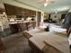 Open-concept kitchen and dining area with a breakfast bar, wood cabinetry, and lots of light at 6237 E Lynn Dr, Mooresville, IN 46158