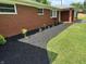 Well-maintained landscaping featuring dark mulch and a variety of plants at 6237 E Lynn Dr, Mooresville, IN 46158