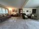 Spacious living room featuring neutral carpet and ample seating at 6237 E Lynn Dr, Mooresville, IN 46158