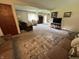 Cozy living room with plush carpeting, neutral tones, and comfortable seating at 6237 E Lynn Dr, Mooresville, IN 46158
