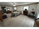 Large main bedroom with carpet, ceiling fan, two windows and three dressers at 6237 E Lynn Dr, Mooresville, IN 46158