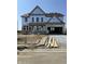 New home in progress featuring two-car garage, gable roof, and ample windows, awaiting completion at 637 Firefly Ct, Greenfield, IN 46140