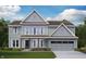 Charming two-story home with lap siding, board and batten, and a two-car garage at 637 Firefly Ct, Greenfield, IN 46140
