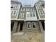 New construction exterior features brick facade, siding, and large windows allowing for natural light at 7309 Bayview Run, McCordsville, IN 46055