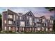 Charming townhome exteriors showcasing diverse architectural styles and inviting curb appeal in a Primary planned community at 7343 Bayview Run # 11-604, McCordsville, IN 46055