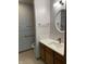 Bathroom featuring vanity with stone countertop, patterned tile floor, and updated fixtures at 7536 Briarstone Dr, Indianapolis, IN 46227