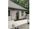 Exterior features a gated entry, manicured planting bed, and brick facade with stone-paved walkway at 7536 Briarstone Dr, Indianapolis, IN 46227