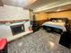Finished basement bedroom with a cozy fireplace and ample space at 7607 Ardwell Ct, Indianapolis, IN 46237