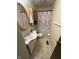 Bathroom featuring a single sink vanity and a shower with a patterned curtain at 7607 Ardwell Ct, Indianapolis, IN 46237