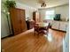 Open dining area with wooden table, chairs, and storage cabinets, bathed in natural light at 7607 Ardwell Ct, Indianapolis, IN 46237