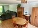 Cozy dining area with a round wooden table, seating for four, and ample space for gatherings at 7607 Ardwell Ct, Indianapolis, IN 46237