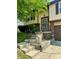 Inviting front entryway featuring metal railing, steps, and landscaped planters in a well-maintained yard at 7607 Ardwell Ct, Indianapolis, IN 46237