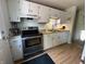 Well-maintained kitchen featuring stainless steel appliances and classic white cabinets at 7607 Ardwell Ct, Indianapolis, IN 46237