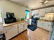 Bright kitchen featuring white cabinets, updated appliances, and a functional layout for cooking at 7607 Ardwell Ct, Indianapolis, IN 46237