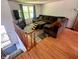 Open living area featuring a large sectional sofa, hardwood floors, and plenty of natural light at 7607 Ardwell Ct, Indianapolis, IN 46237