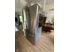 Modern stainless steel refrigerator positioned near dining area with natural light at 7607 Ardwell Ct, Indianapolis, IN 46237