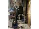 Well-equipped utility area with water heater, shelving, and laundry supplies at 7607 Ardwell Ct, Indianapolis, IN 46237