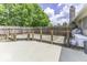 Backyard with a wooden deck, a fence, a grill, and a concrete patio at 7741 Long Branch Dr, Indianapolis, IN 46259